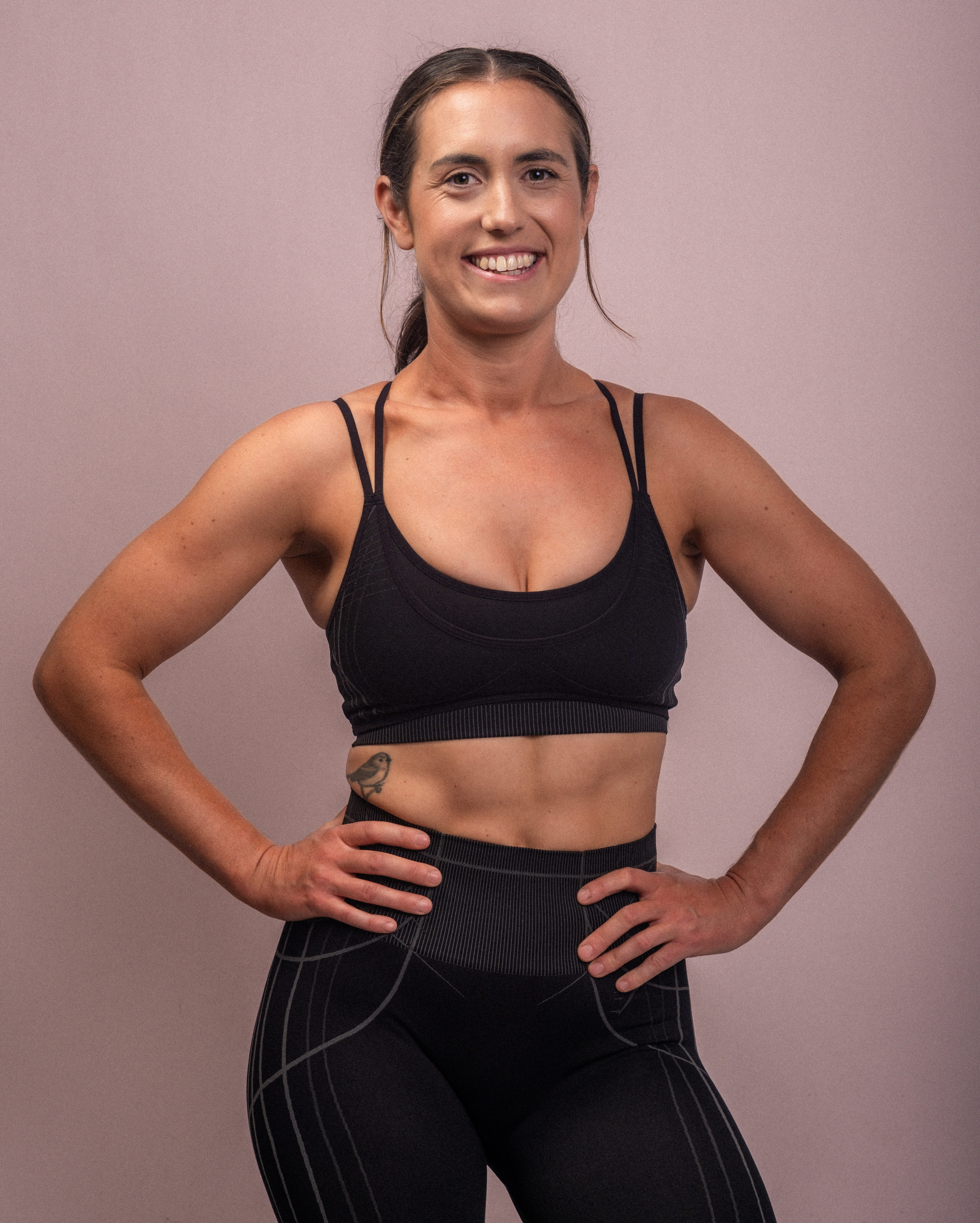 Steph smiling with hands on hips